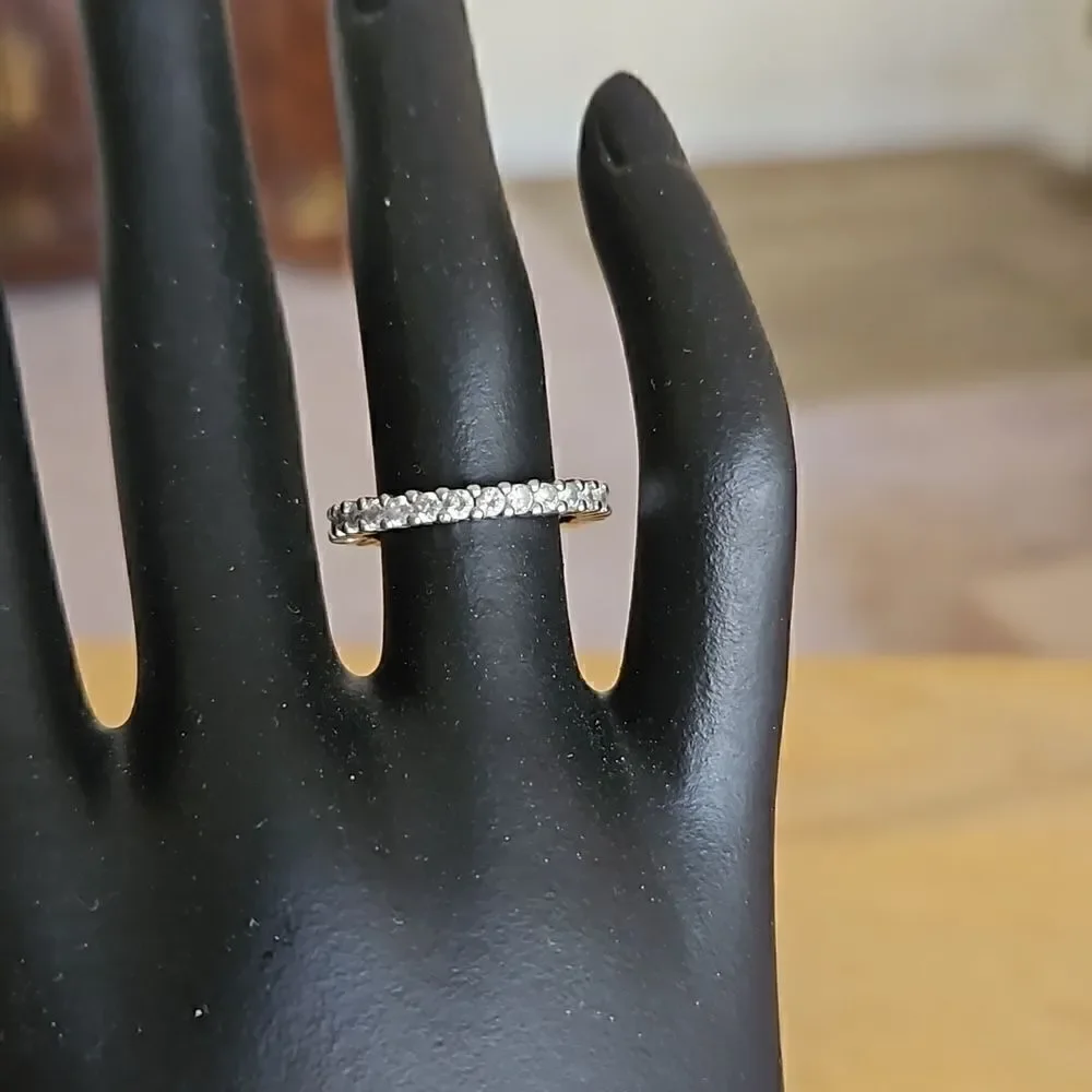 Sterling silver band (stamped 925) with cubic  zeconia.